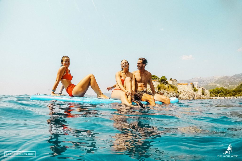 girls with a guy floating at the yacht week