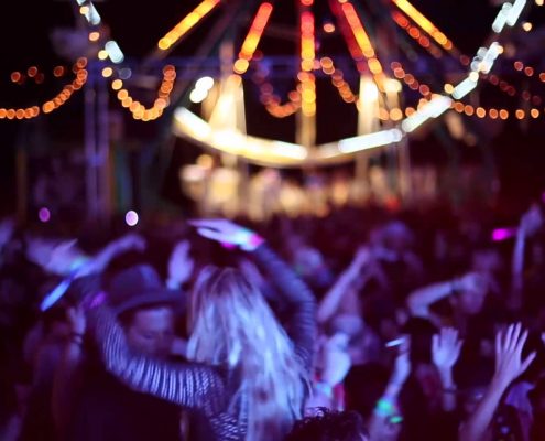people dancing at neon carnival