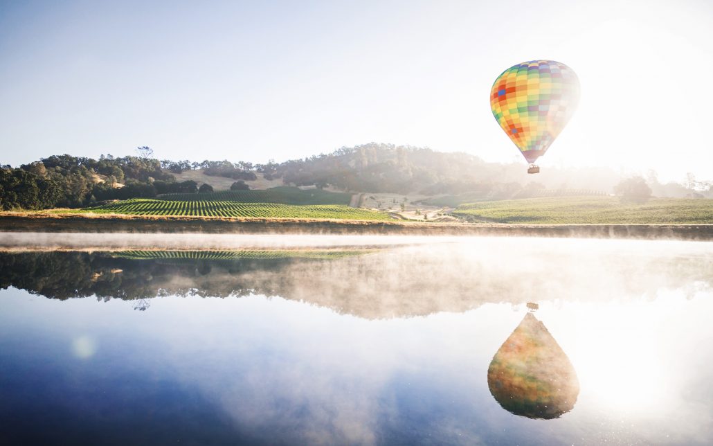 hot air balloon over water in napa honeymoon destination