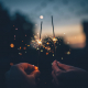 where to watch 4th of july fireworks people holding sparkler