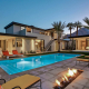 palm springs villa rental pool at night with firepit
