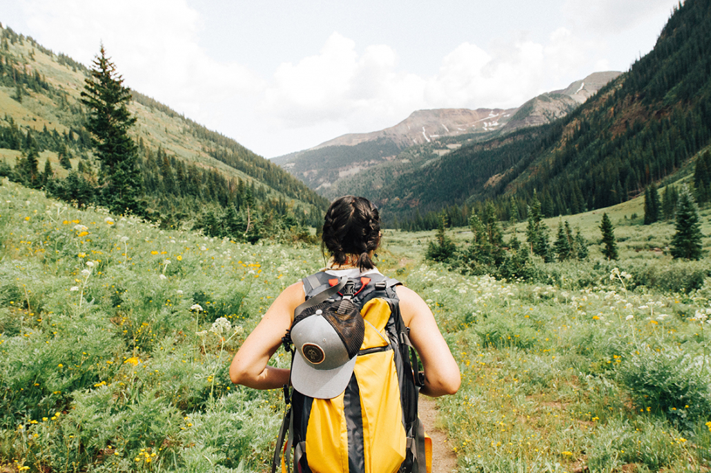 girl hiking with backpack outdoor travel