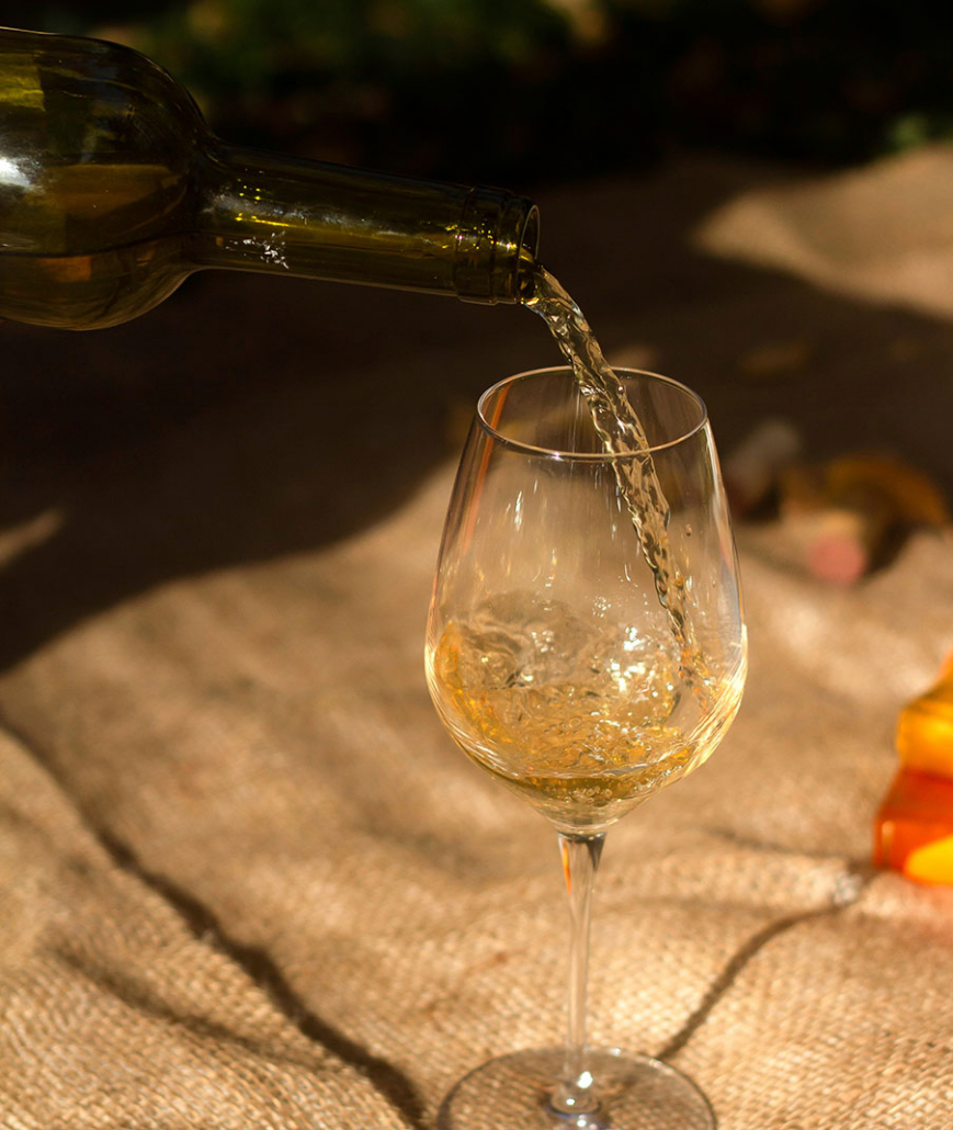 pouring a glass of wine in wine country