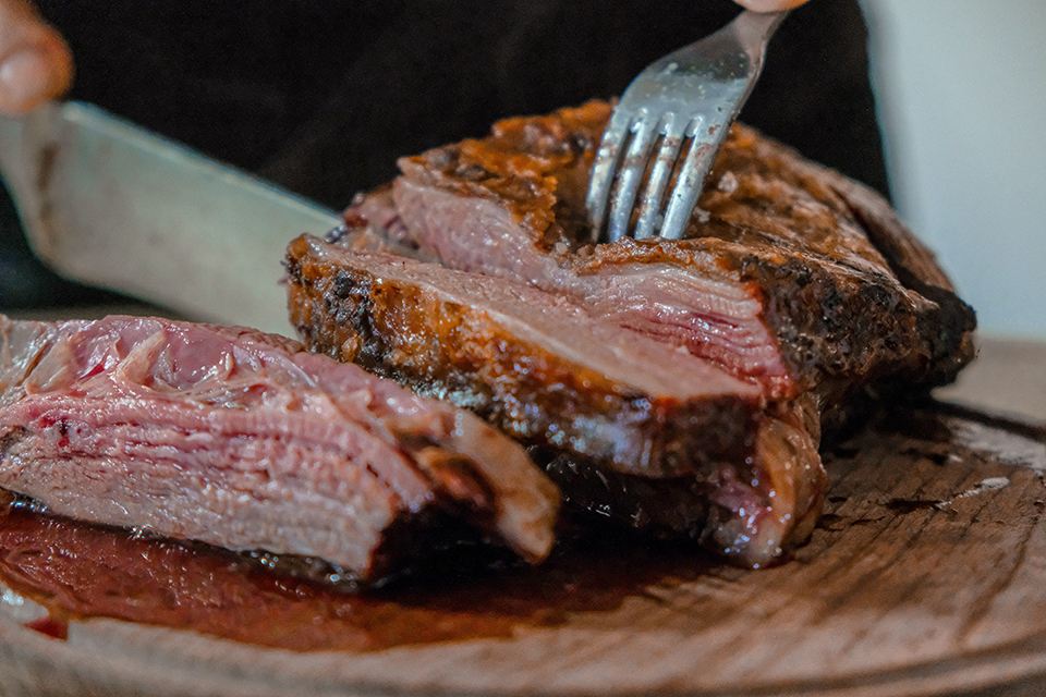 cutting steak at the table