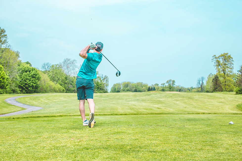 guy playing golf