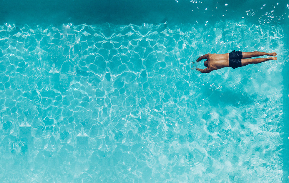 guy swimming in a pool